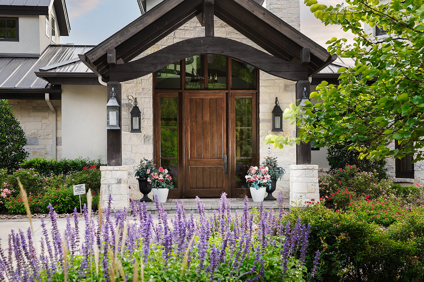 Cedar-beamed front entry with custom door surround
